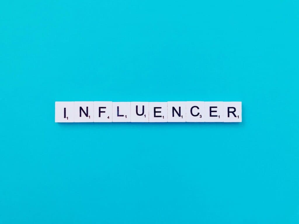 scrabble pieces spelling Influencer