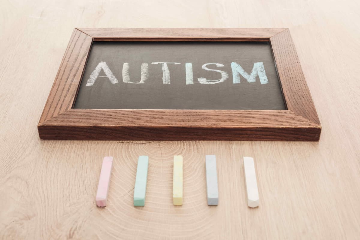 autism-lettering-written-on-chalkboard-near-multic-2023-11-27-04-51-48-utc-min.jpg