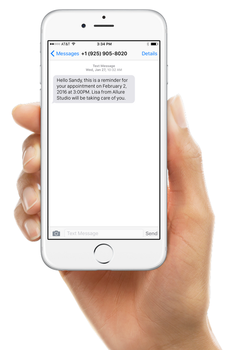 A phone showing customer text notification from Vagaro appointment reminder software