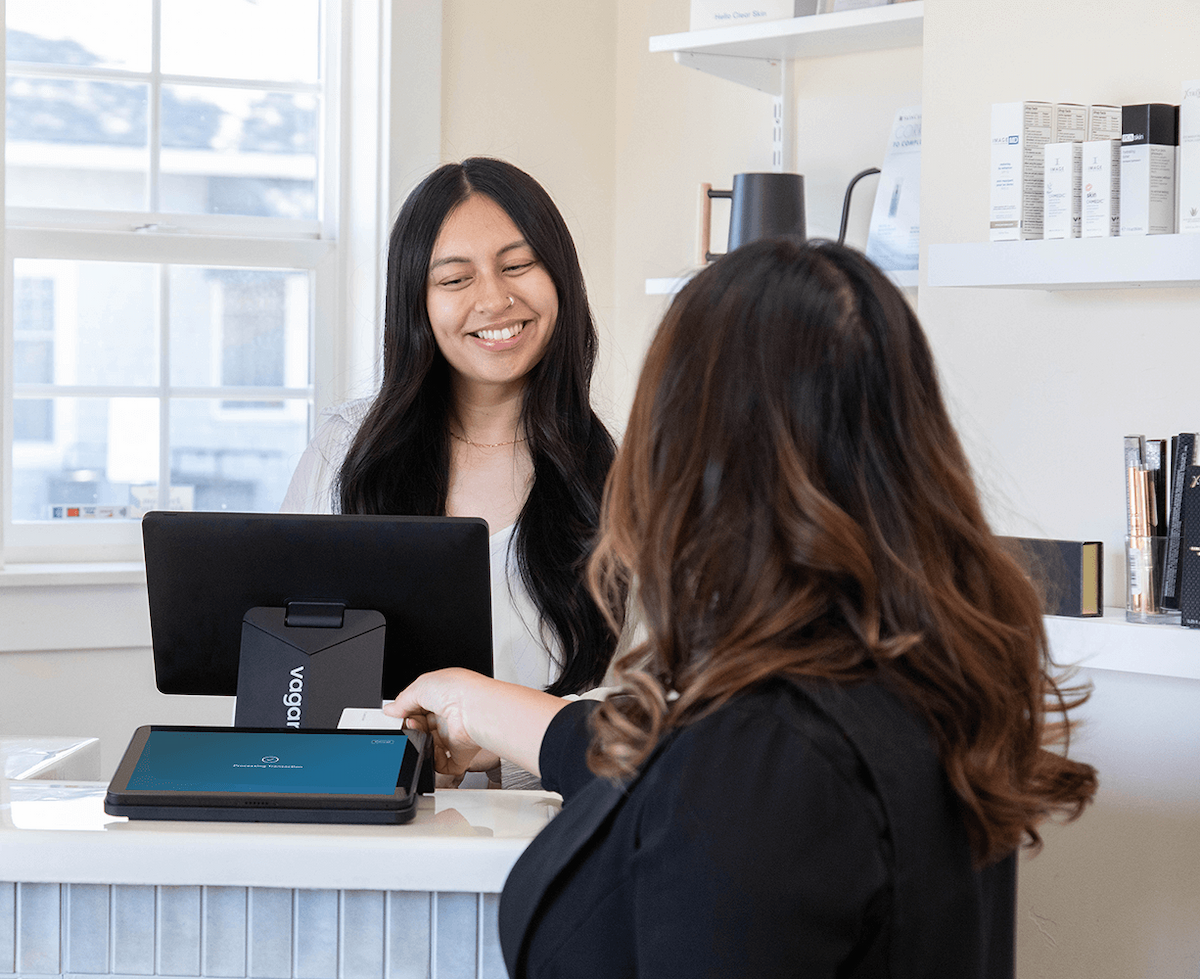 customer completing checkout by apple pay on a dual touchscreen point of sale system