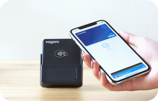 A person using Apple pay on Vagaro's salon POS card reader.
